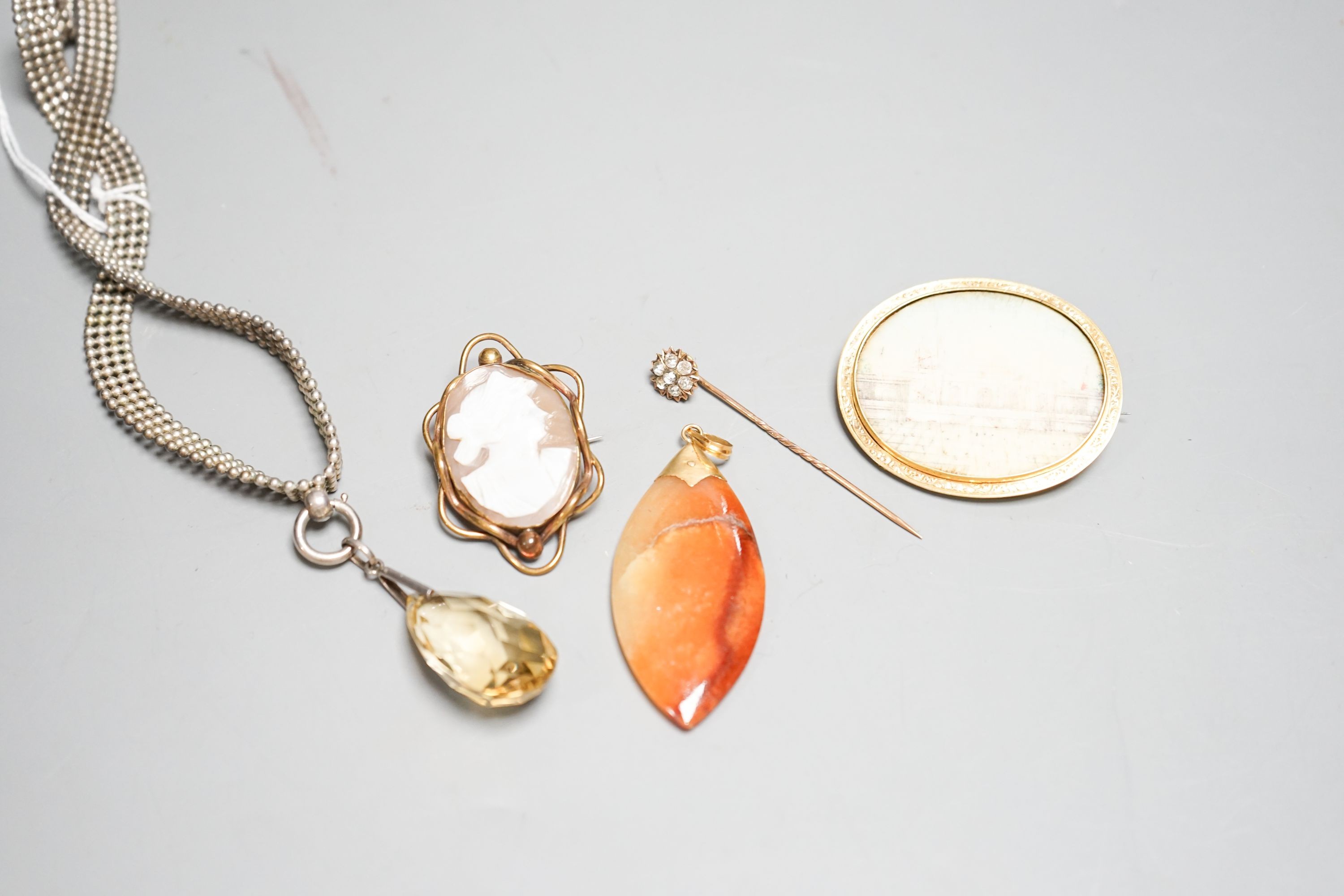 Mixed jewellery including cameo brooch, agate pendant, oval brooch, paste set stick pin and pendant on white metal chain.